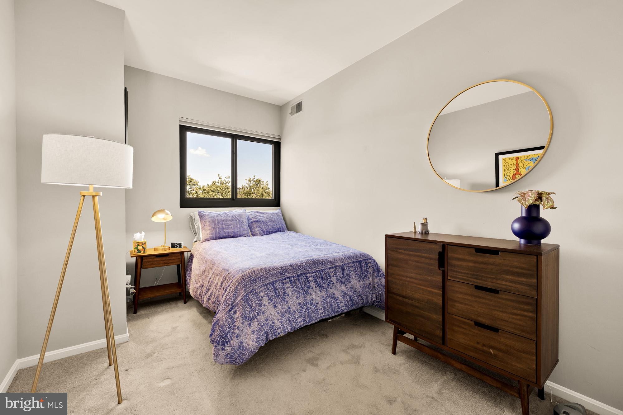 1715 15th Street Northwest, Unit 401 Washington, DC 20009 - Photo 13 of 28 a bedroom with a bed and a chandelier