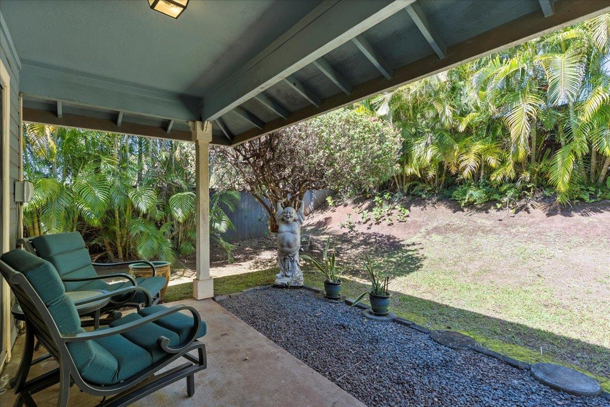 81 Lae Street Paia, HI 96779 - Photo 24 of 47 a backyard of a house with outdoor seating
