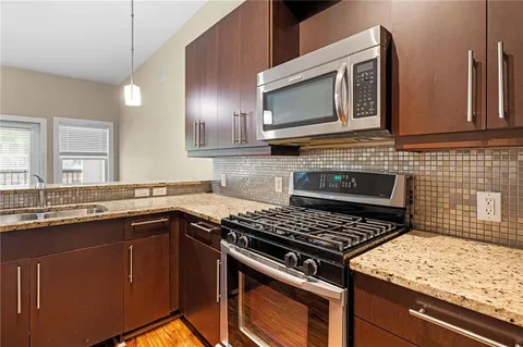 a kitchen with a stove and a sink