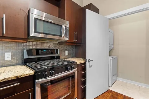 a kitchen with a stove and a microwave