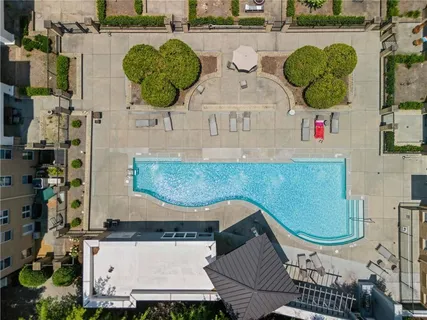 an aerial view of a swimming pool and outdoor space