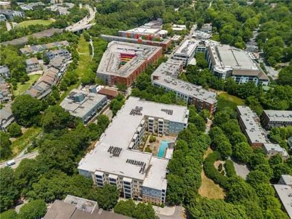 an aerial view of residential houses with outdoor space