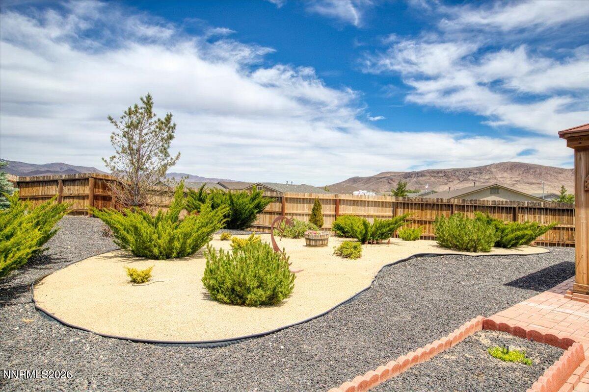 104 Bethpage Road Dayton, NV 89403 - Photo 41 of 65 a view of a swimming pool with a lounge chair