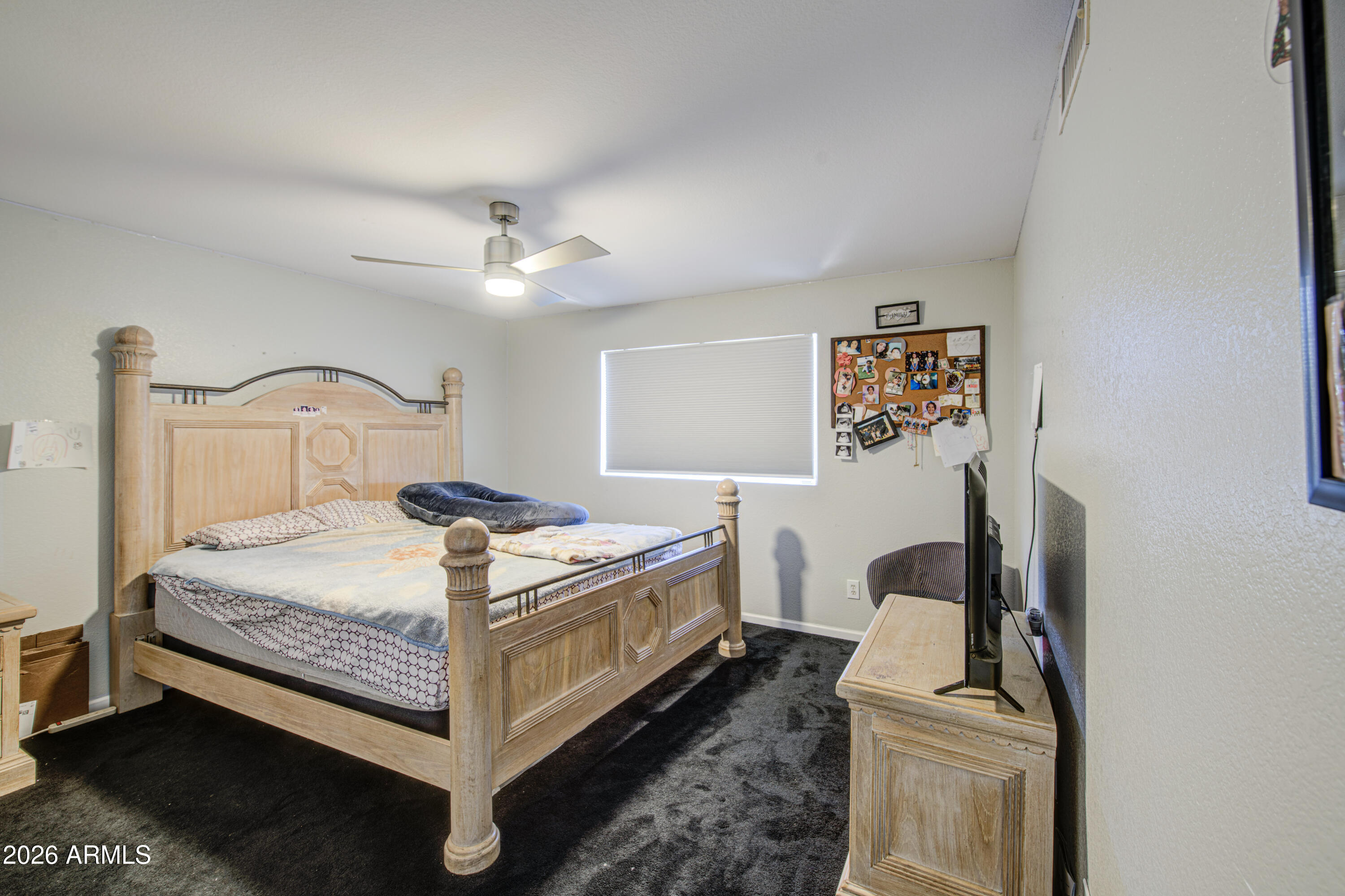 12403 West Monte Vista Road Avondale, AZ 85392 - Photo 40 of 63 a bedroom with a bed and a potted plant