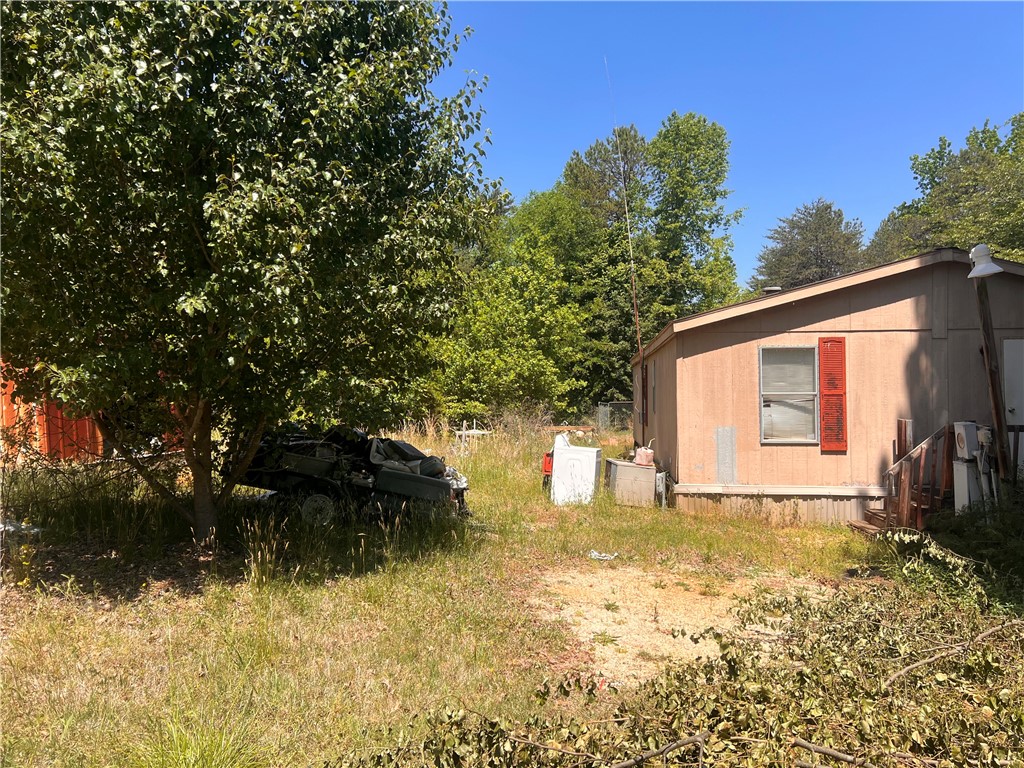 284 State Rd S-37-138 Fair Play, SC 29643 - Photo 6 of 15 This charming home offers a tranquil escape amidst lush greenery and open spaces.