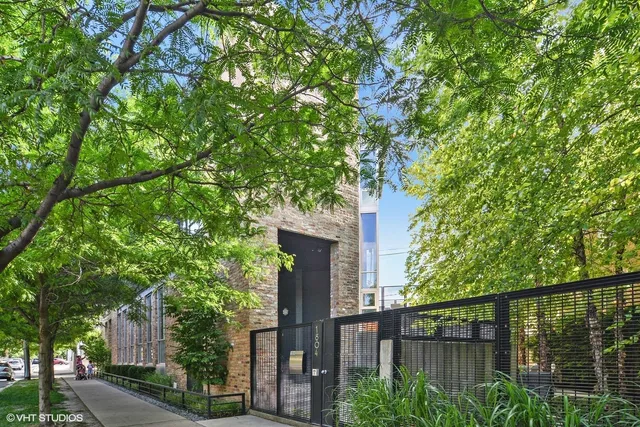 front view of a house with a tree