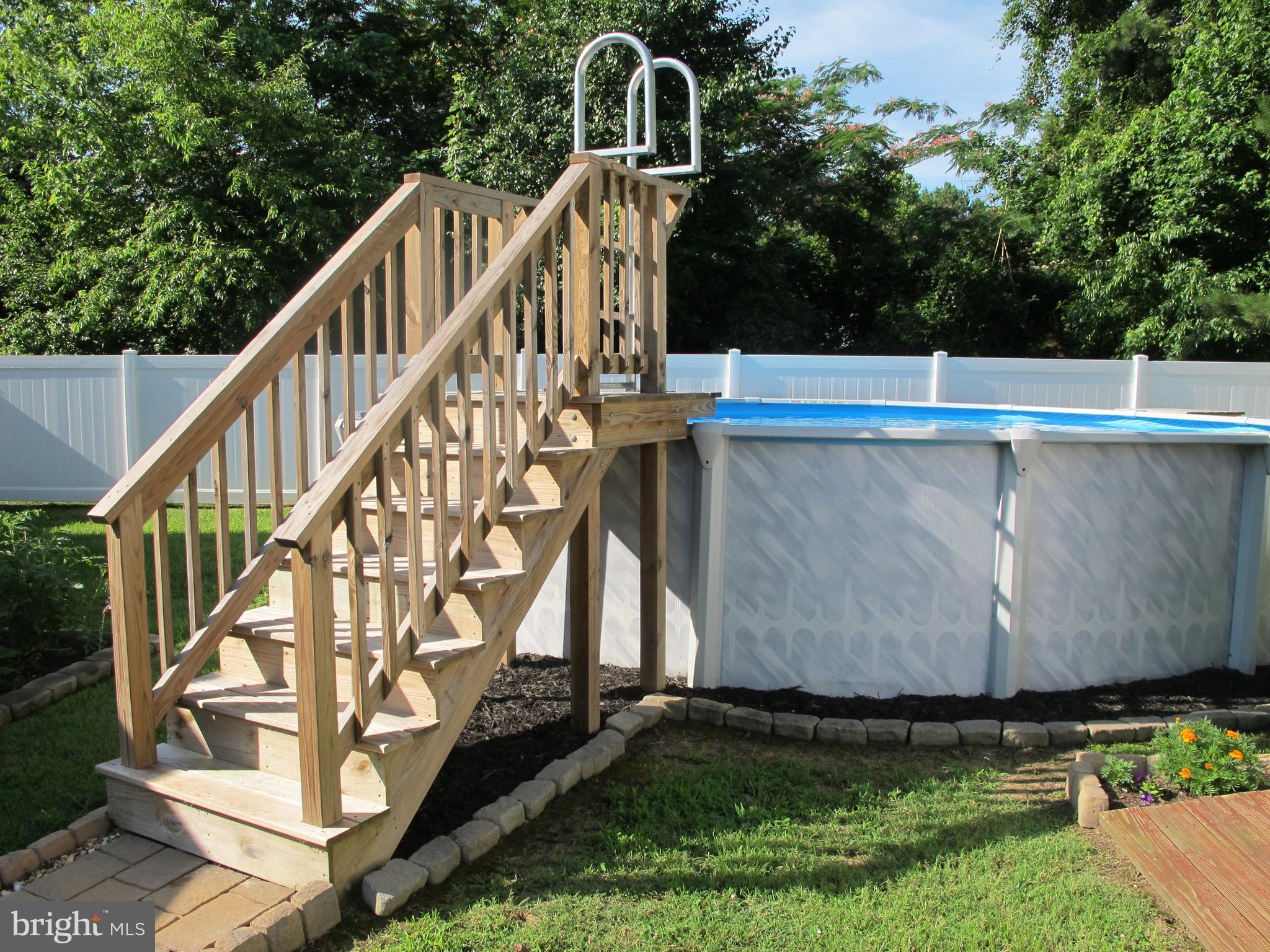 107 Rolando Drive Colonial Beach, VA 22443 - Photo 14 of 30 Pool with nice solid wood steps.