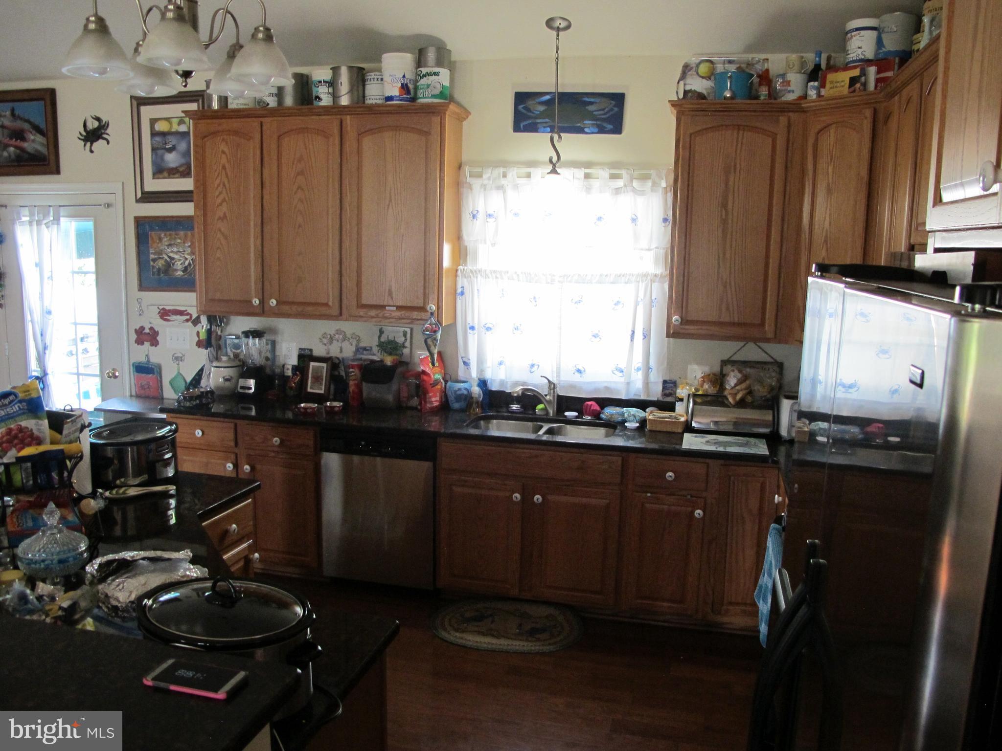 107 Rolando Drive Colonial Beach, VA 22443 - Photo 22 of 30 Kitchen area with stainless steel appliances.