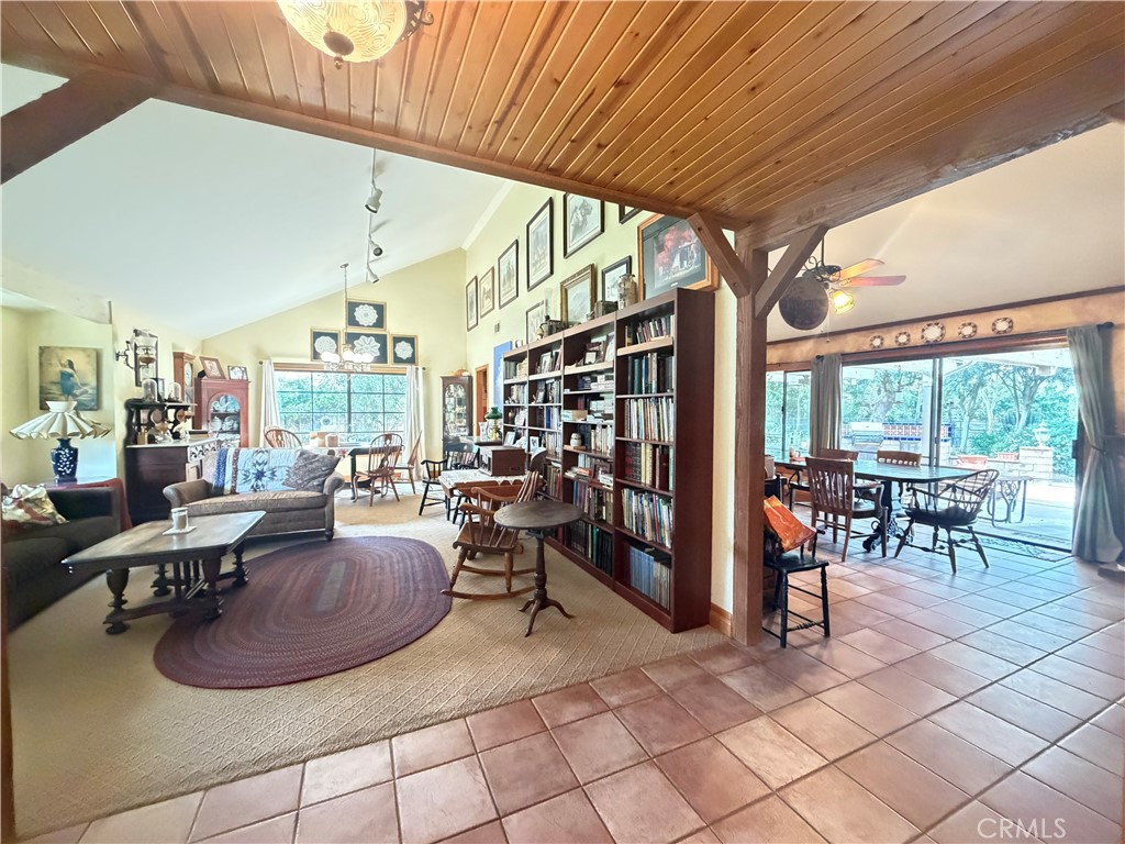 377 Oldstone Court Simi Valley, CA 93065 - Photo 8 of 44 a living room with furniture a dining table and a large window