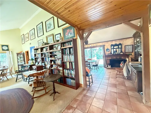 a reading room with furniture and a book shelf