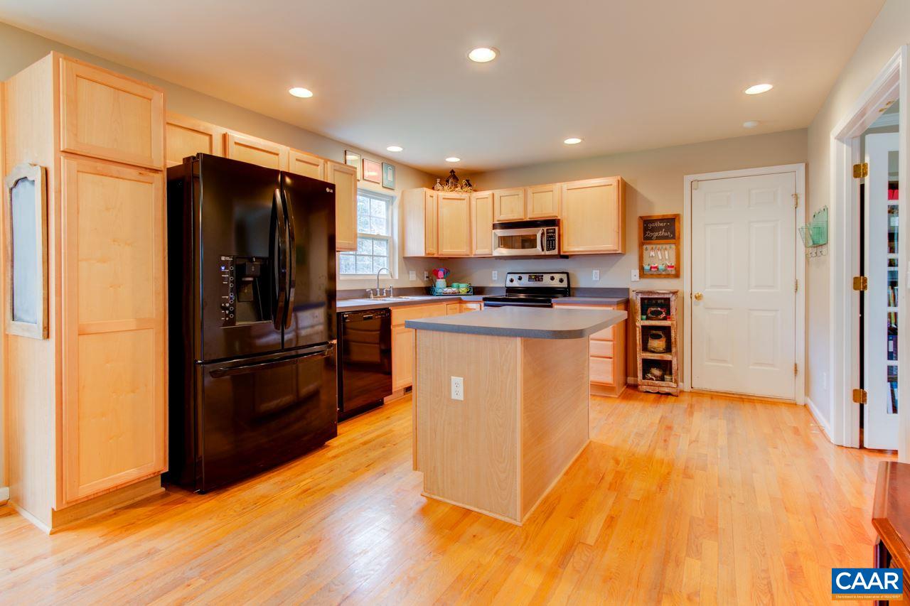 1319 Troy Road Troy, VA 22974 - Photo 15 of 41 a kitchen with stainless steel appliances granite countertop a refrigerator a stove top oven a sink and dishwasher