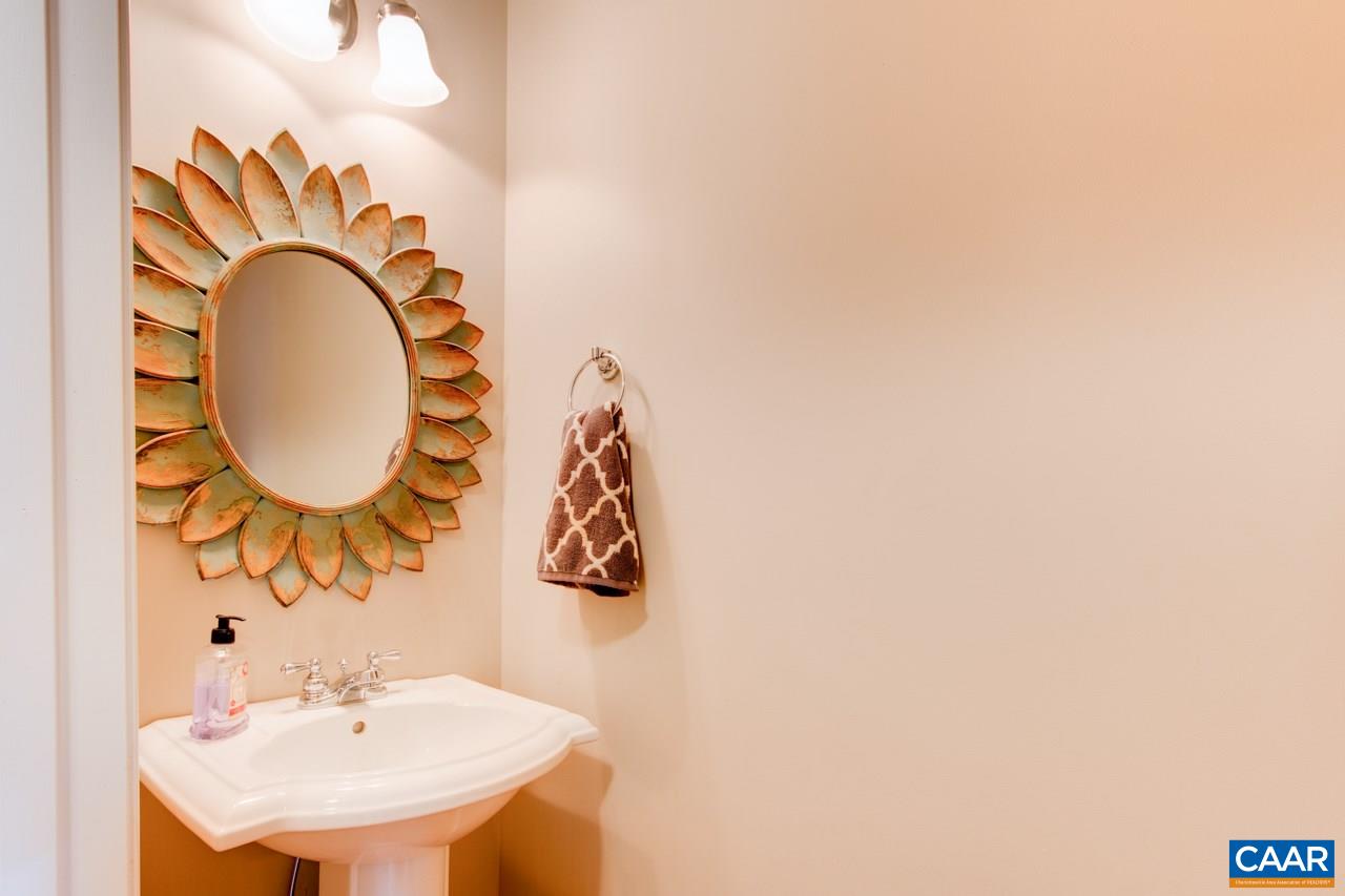 1319 Troy Road Troy, VA 22974 - Photo 17 of 41 a bathroom with a sink and a mirror