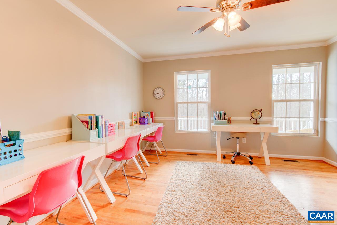 1319 Troy Road Troy, VA 22974 - Photo 18 of 41 a living room with a dining table and a large window