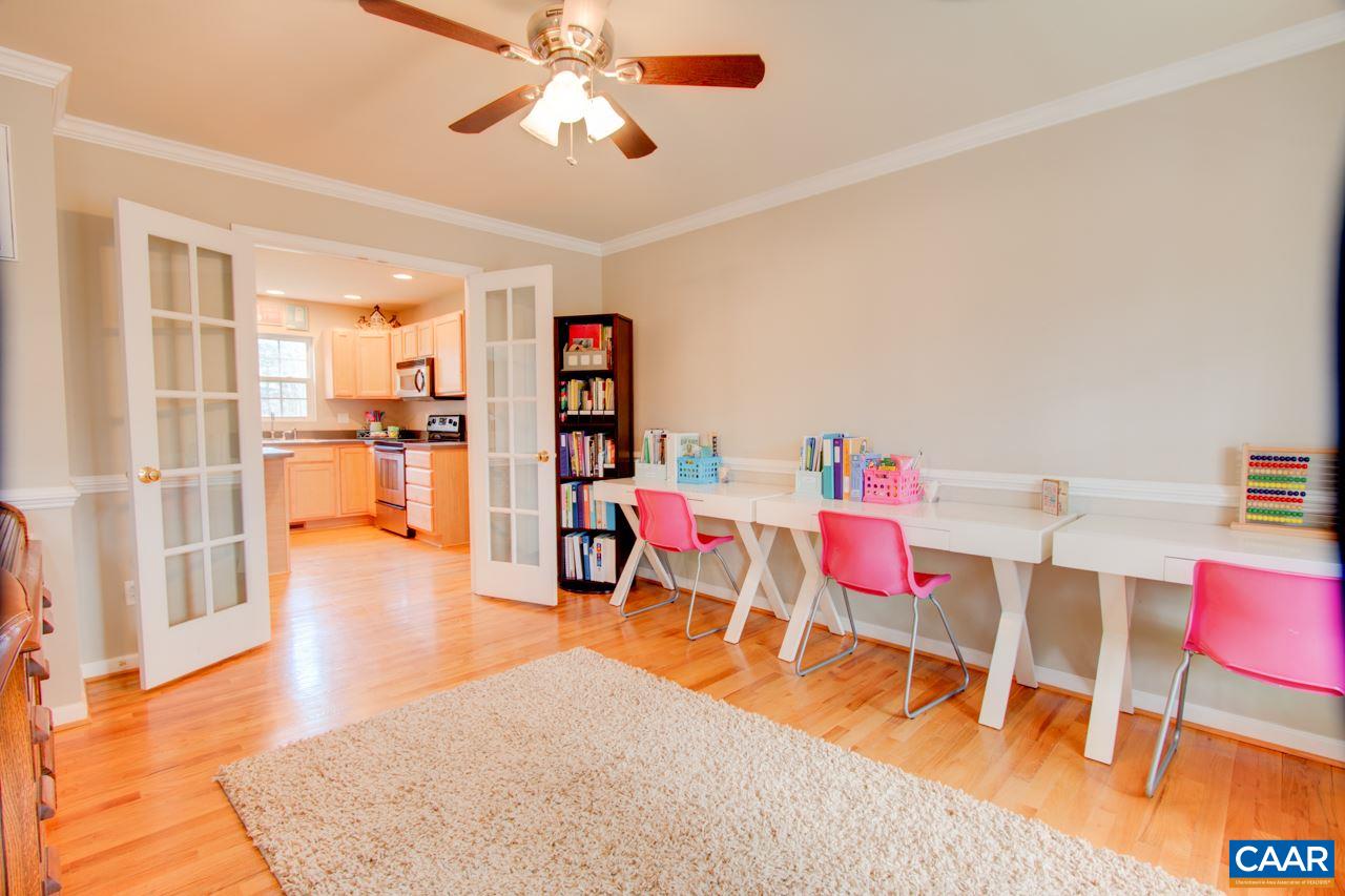 1319 Troy Road Troy, VA 22974 - Photo 19 of 41 a living room with dining room and wooden floor