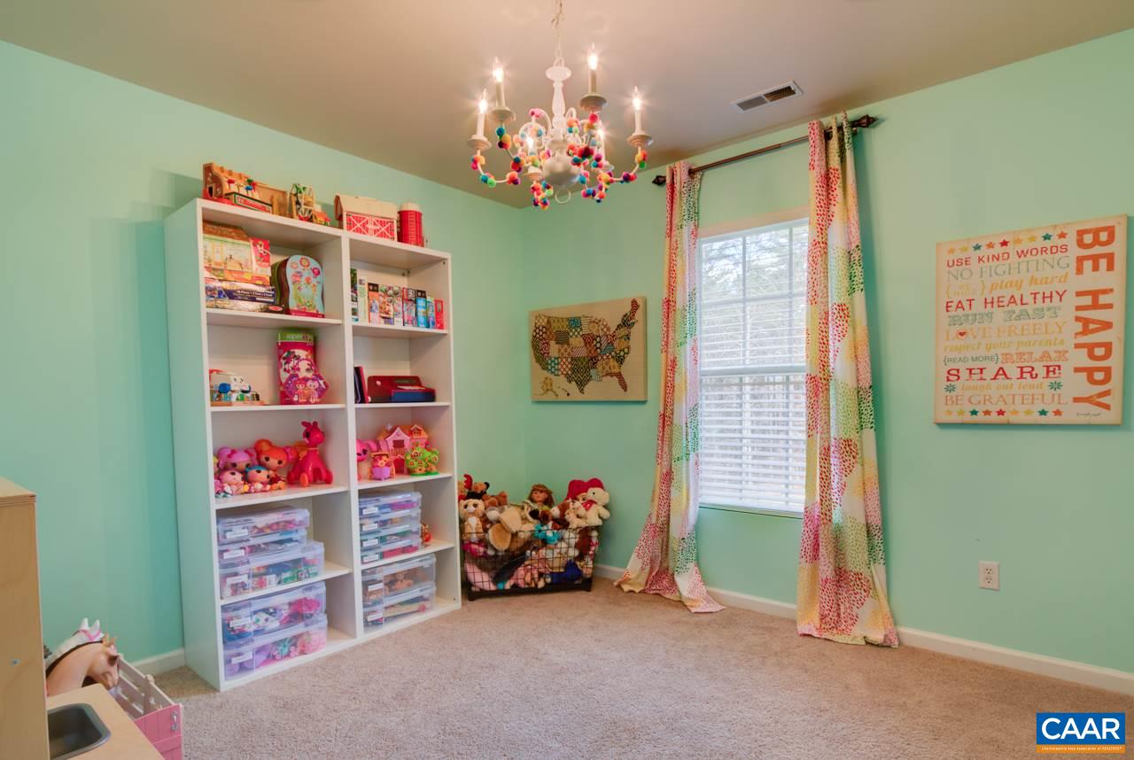 1319 Troy Road Troy, VA 22974 - Photo 22 of 41 a livingroom with toys and a chandelier