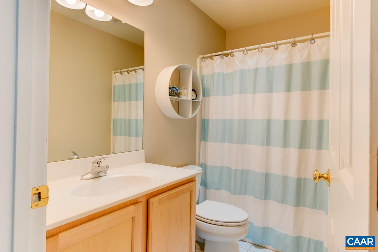 1319 Troy Road Troy, VA 22974 - Photo 26 of 41 a bathroom with a sink and a mirror