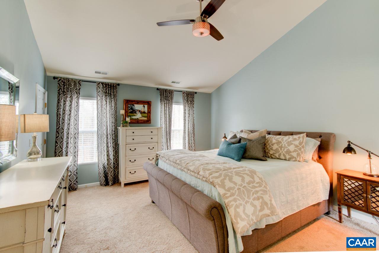 1319 Troy Road Troy, VA 22974 - Photo 27 of 41 a bedroom with a bed and a couch