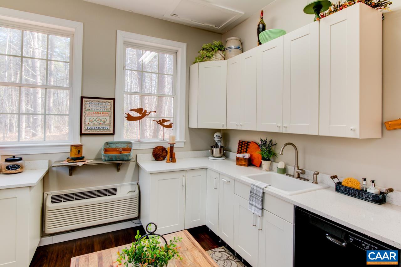 1319 Troy Road Troy, VA 22974 - Photo 33 of 41 a kitchen with white cabinets and window