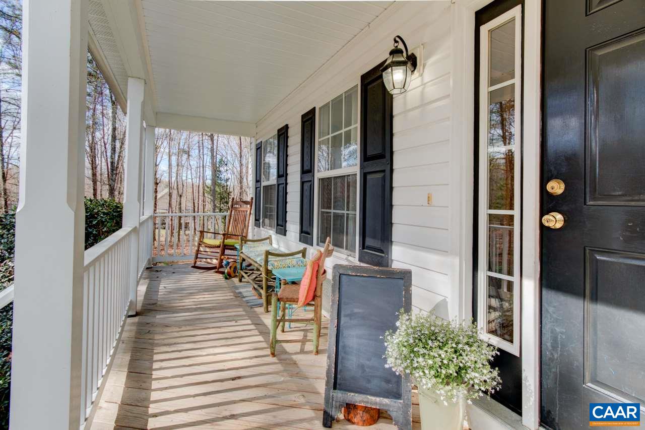 1319 Troy Road Troy, VA 22974 - Photo 4 of 41 a balcony with furniture and large windows