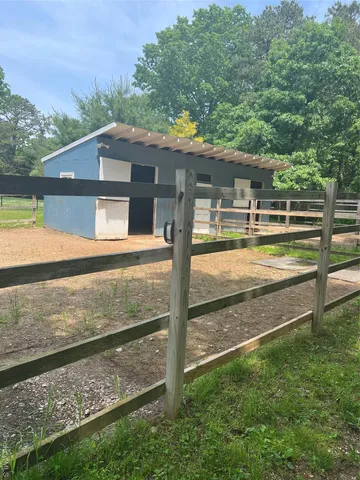 a swimming pool with trees in the background