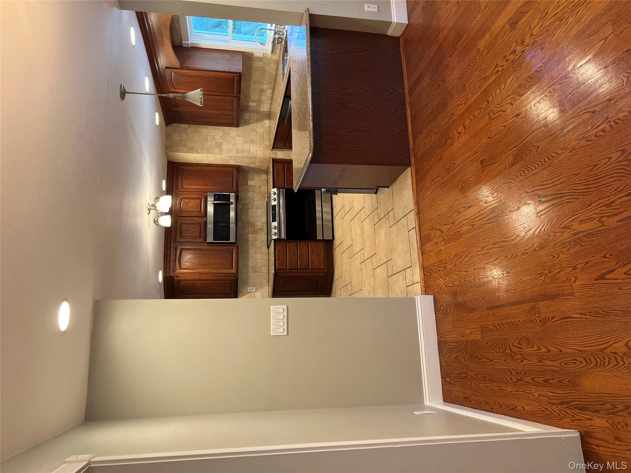 10 Jonah Road Miller Place, NY 11764 - Photo 3 of 16 a view of kitchen with microwave and cabinets