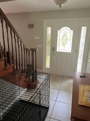 a view of entryway with wooden floor