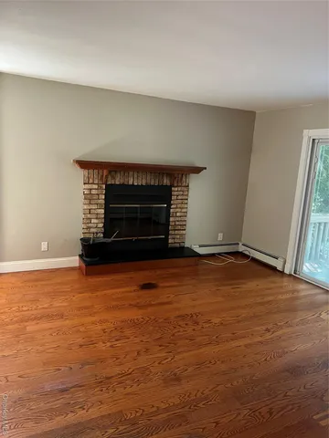 an empty room with a fireplace