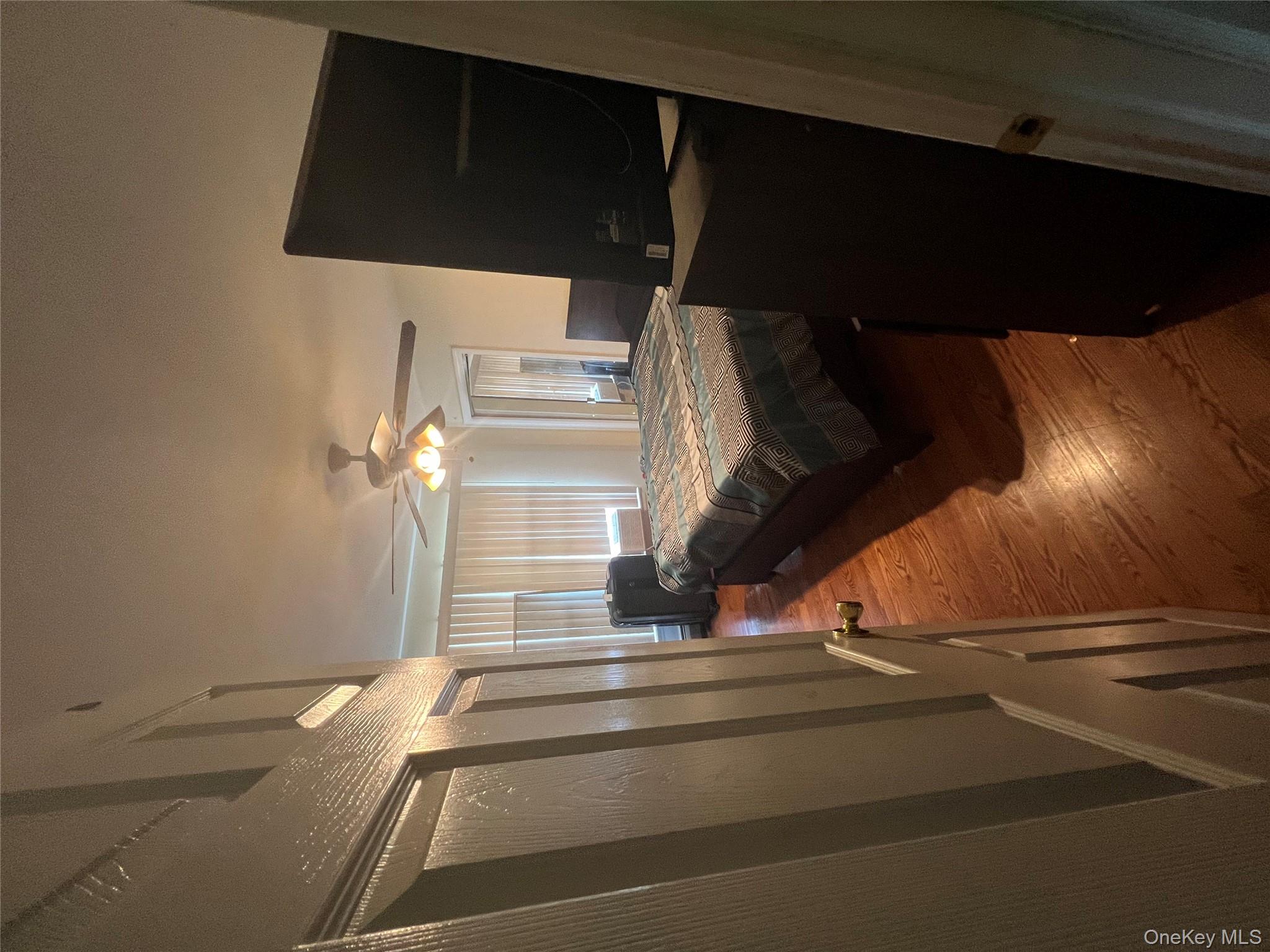 10 Jonah Road Miller Place, NY 11764 - Photo 10 of 16 a bedroom with a bed furniture and a large window