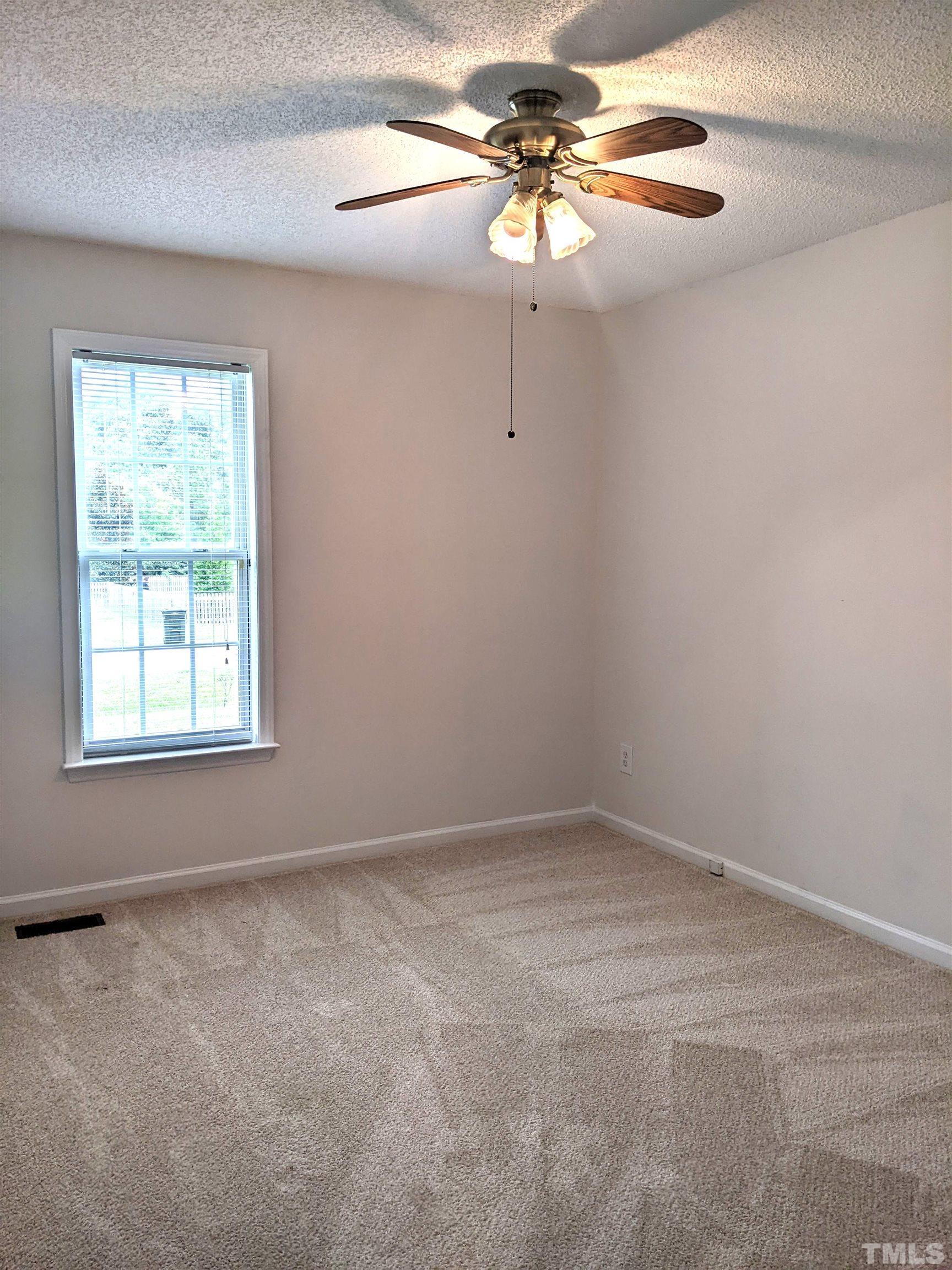 1629 Tall Cane Circle Willow Spring, NC 27592 - Photo 11 of 23 an empty room with a window