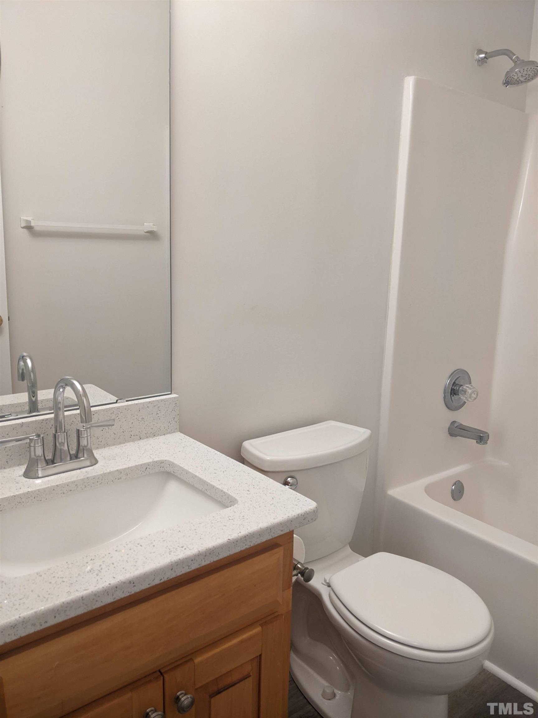 1629 Tall Cane Circle Willow Spring, NC 27592 - Photo 13 of 23 a bathroom with a sink a toilet and shower