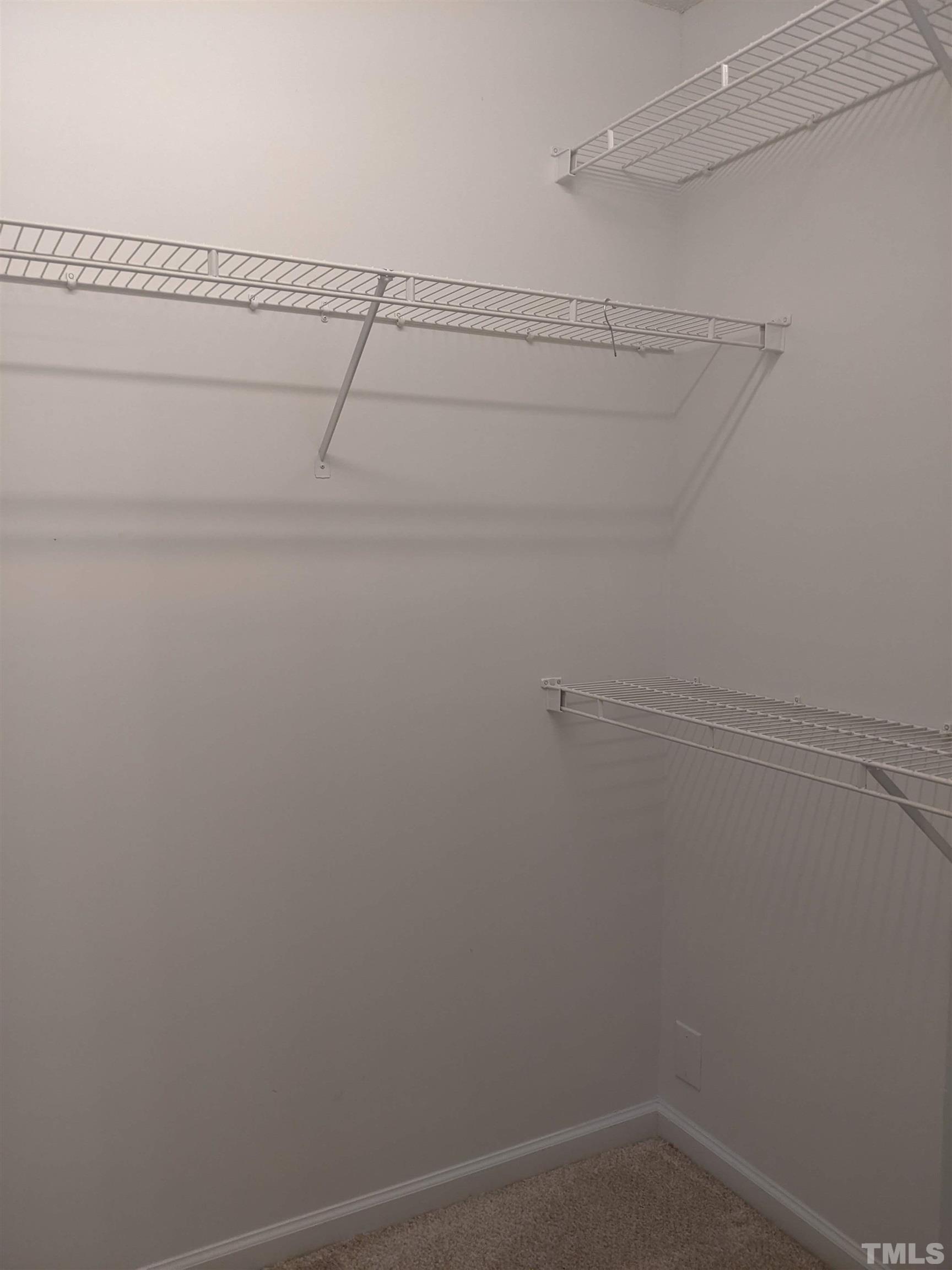 1629 Tall Cane Circle Willow Spring, NC 27592 - Photo 18 of 23 a view of a room with racks on the wall