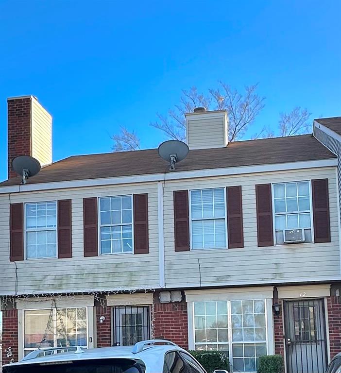 10500 Lake June Road, Unit I02 Dallas, TX 75217 - Photo 2 of 2 a front view of a house with a yard
