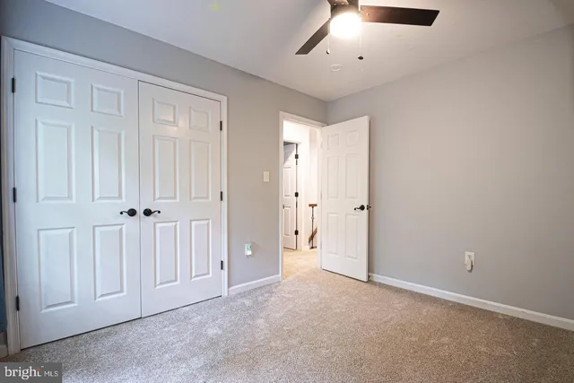 a view of outdoor space with deck and floor to ceiling window