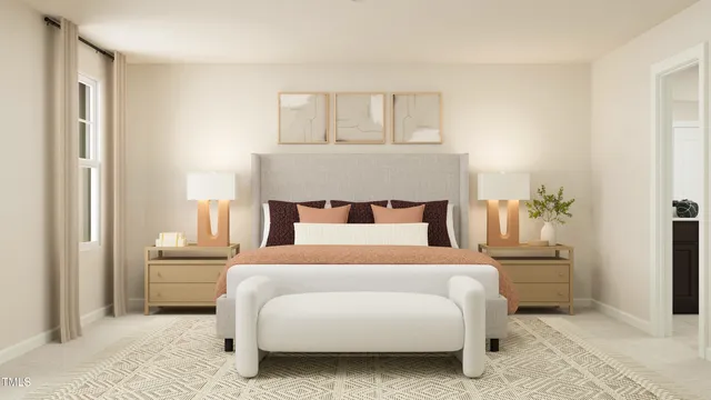 a bedroom with a large bed and a chandelier