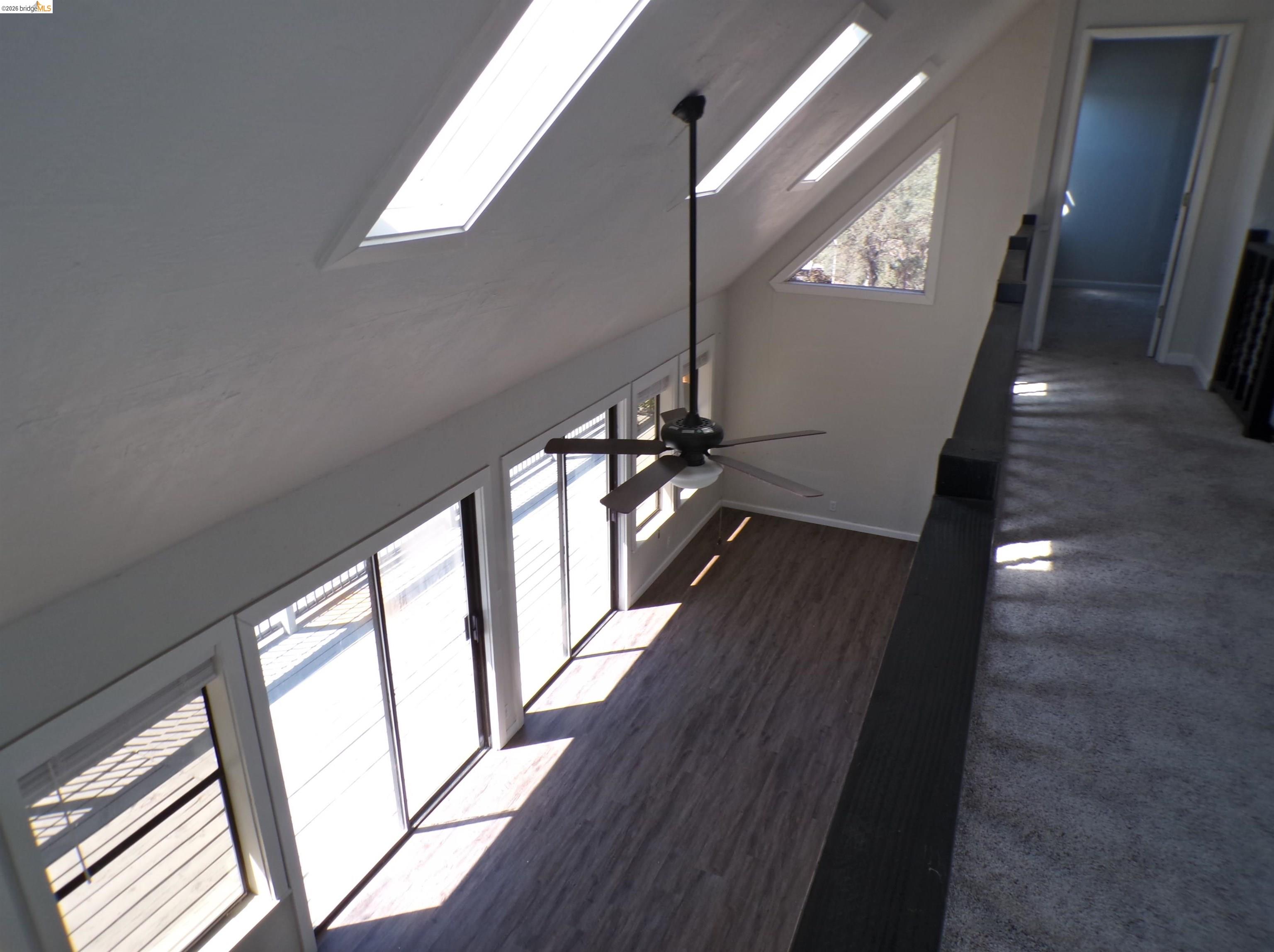 4271 Council Trail Copperopolis, CA 95228 - Photo 20 of 32 Vaulted ceiling featuring multiple skylights and a ceiling fan