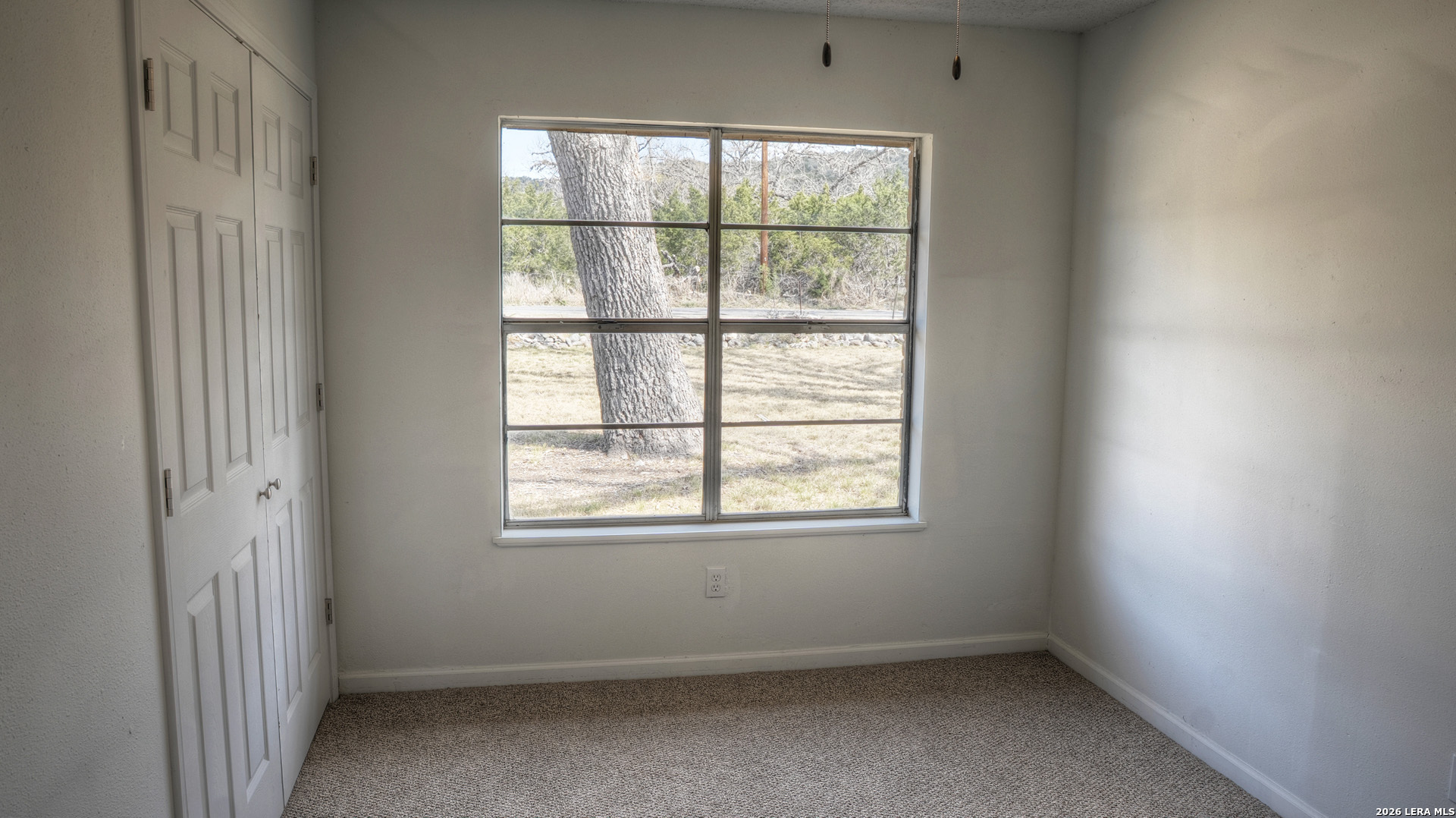 311 Patterson Creek Road Leakey, TX 78873 - Photo 11 of 16 an empty room with a window