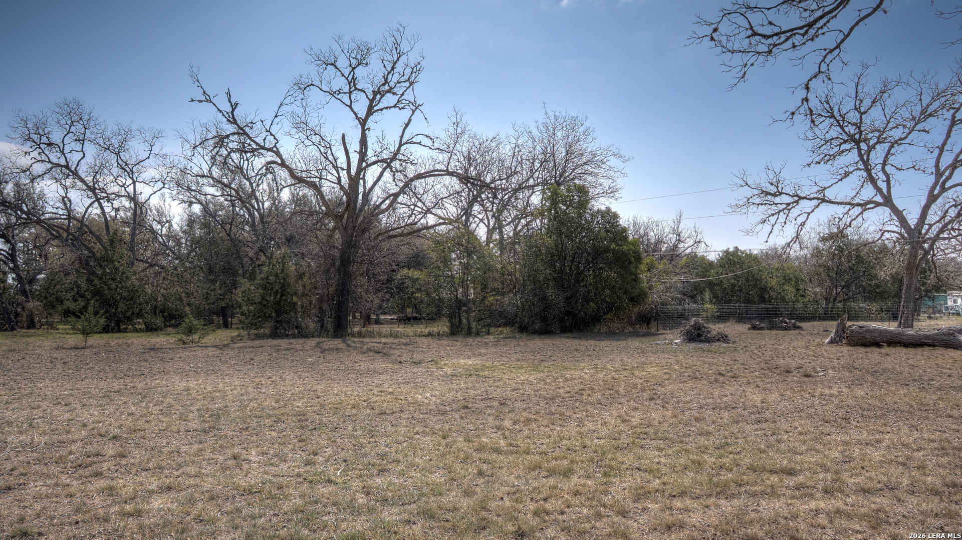 311 Patterson Creek Road Leakey, TX 78873 - Photo 15 of 16 a backyard of a house with lots of trees