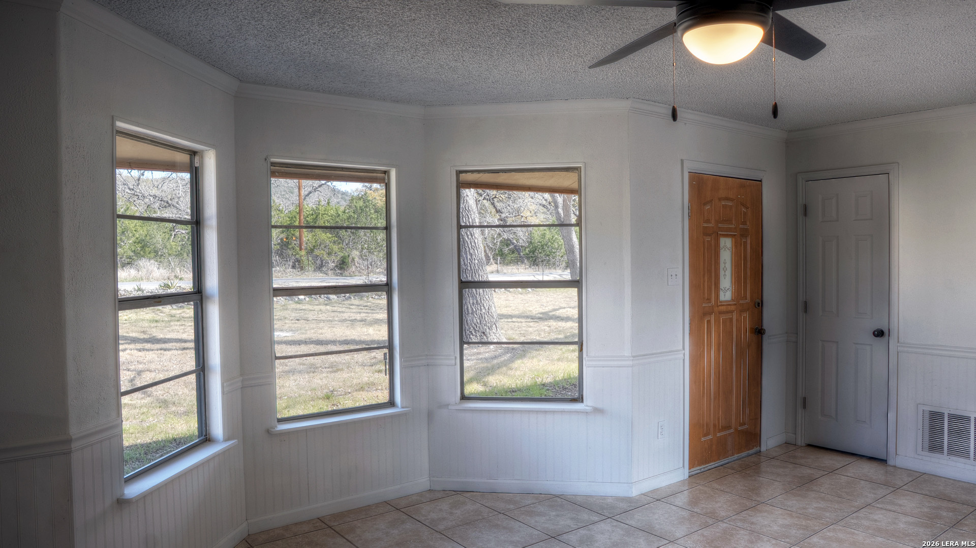 311 Patterson Creek Road Leakey, TX 78873 - Photo 3 of 16 an empty room that has a window