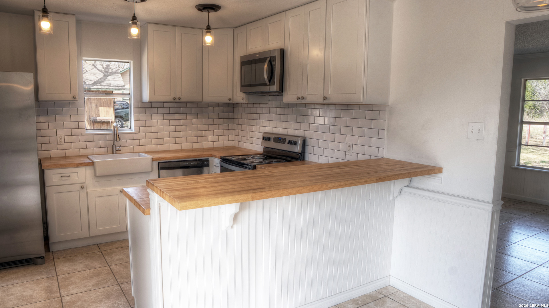 311 Patterson Creek Road Leakey, TX 78873 - Photo 5 of 16 a kitchen that has a sink and a stove in it