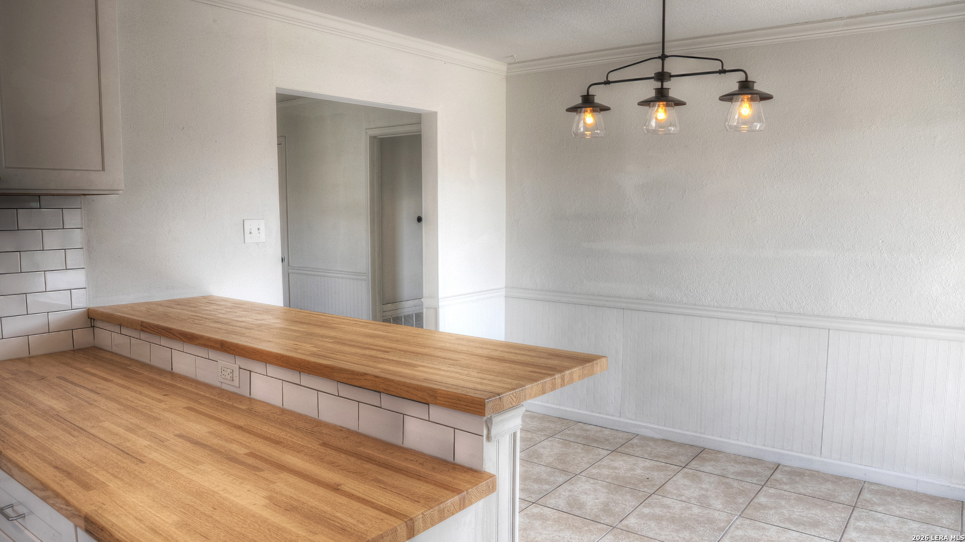311 Patterson Creek Road Leakey, TX 78873 - Photo 6 of 16 a bedroom with a bed and a chandelier