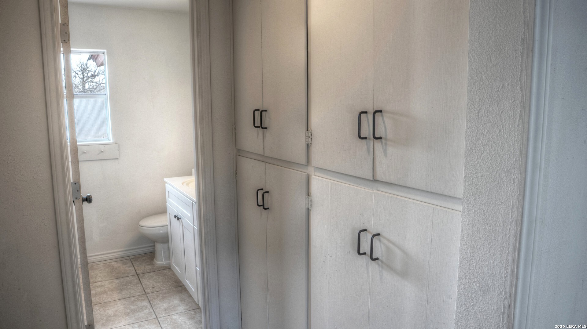 311 Patterson Creek Road Leakey, TX 78873 - Photo 9 of 16 a bathroom with a granite countertop toilet