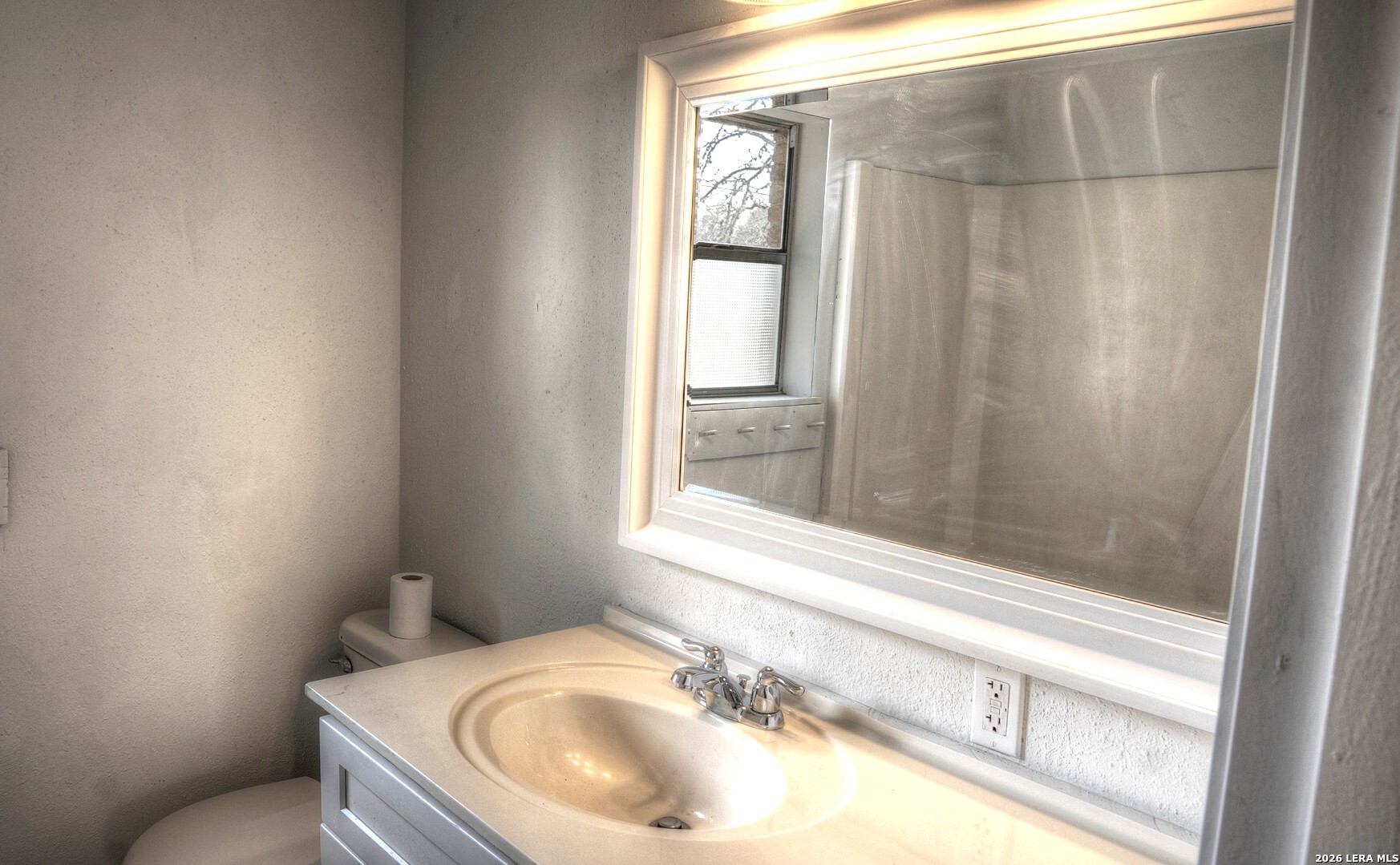 311 Patterson Creek Road Leakey, TX 78873 - Photo 10 of 16 a bathroom with a sink and a window