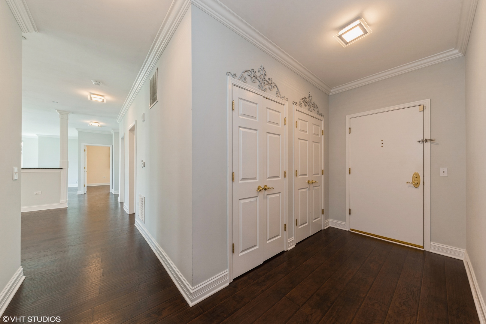 620 McHenry Road, Unit 205 Wheeling, IL 60090 - Photo 4 of 28 wooden floor with white walls