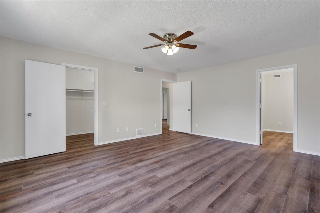 209 Mistletoe Lane Keene, TX 76059 - Photo 19 of 38 a view of an empty room with wooden floor