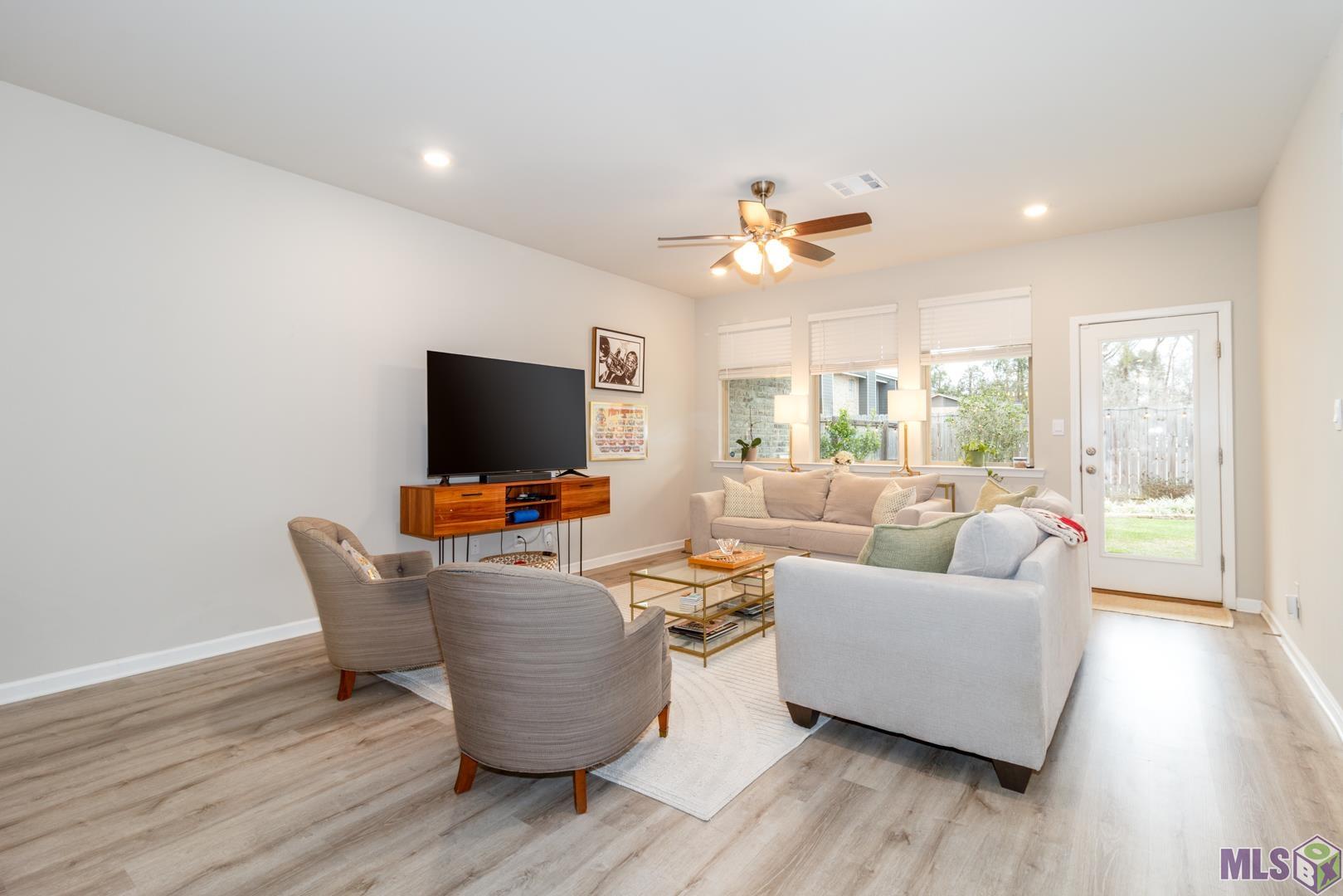 6407 Tiger Pointe Dr. St. George, LA 70817 - Photo 2 of 23 Light-filled living area
