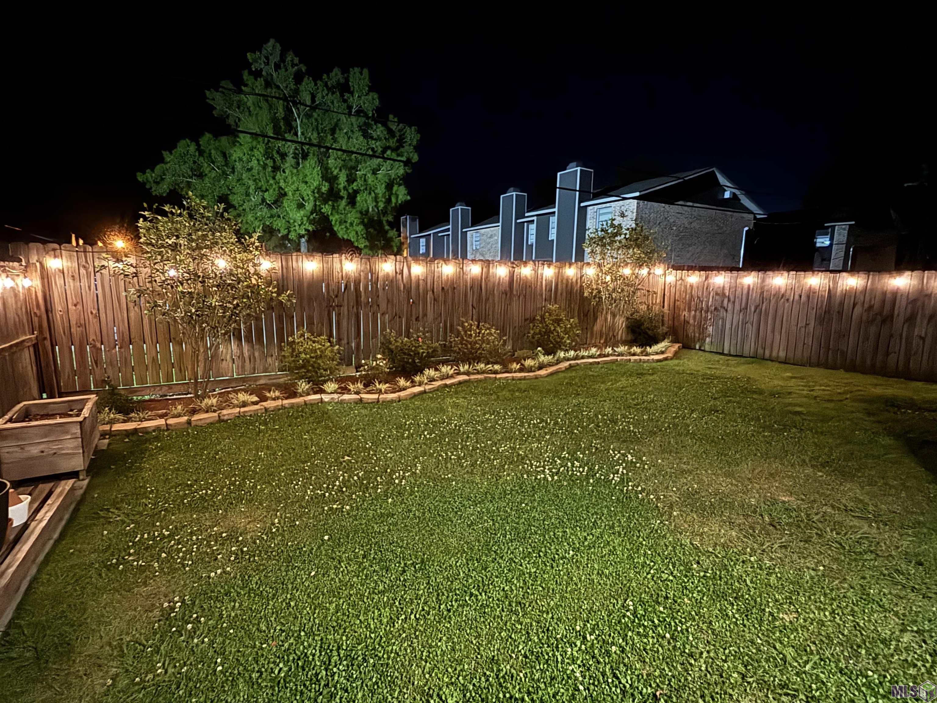 6407 Tiger Pointe Dr. St. George, LA 70817 - Photo 23 of 23 View of backyard at night