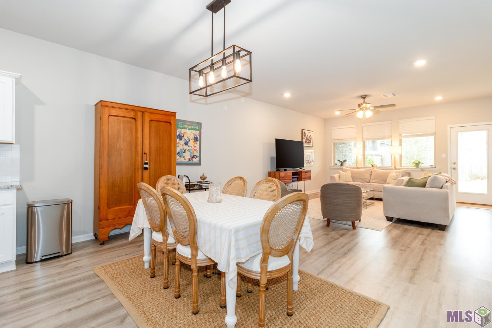 6407 Tiger Pointe Dr. St. George, LA 70817 - Photo 8 of 23 Dining area situated between kitchen and living area