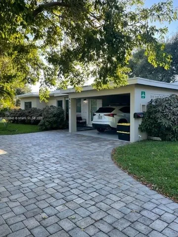a house view with a garden space