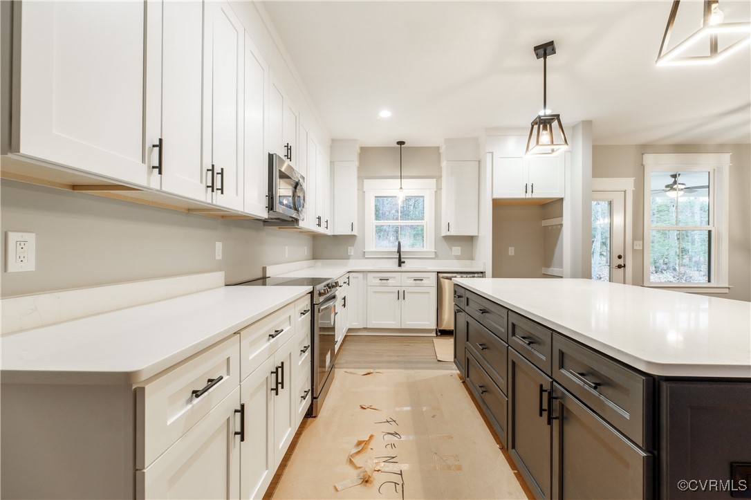 1427 Page Road Powhatan, VA 23139 - Photo 5 of 28 Kitchen with plenty of natural light, white cabine