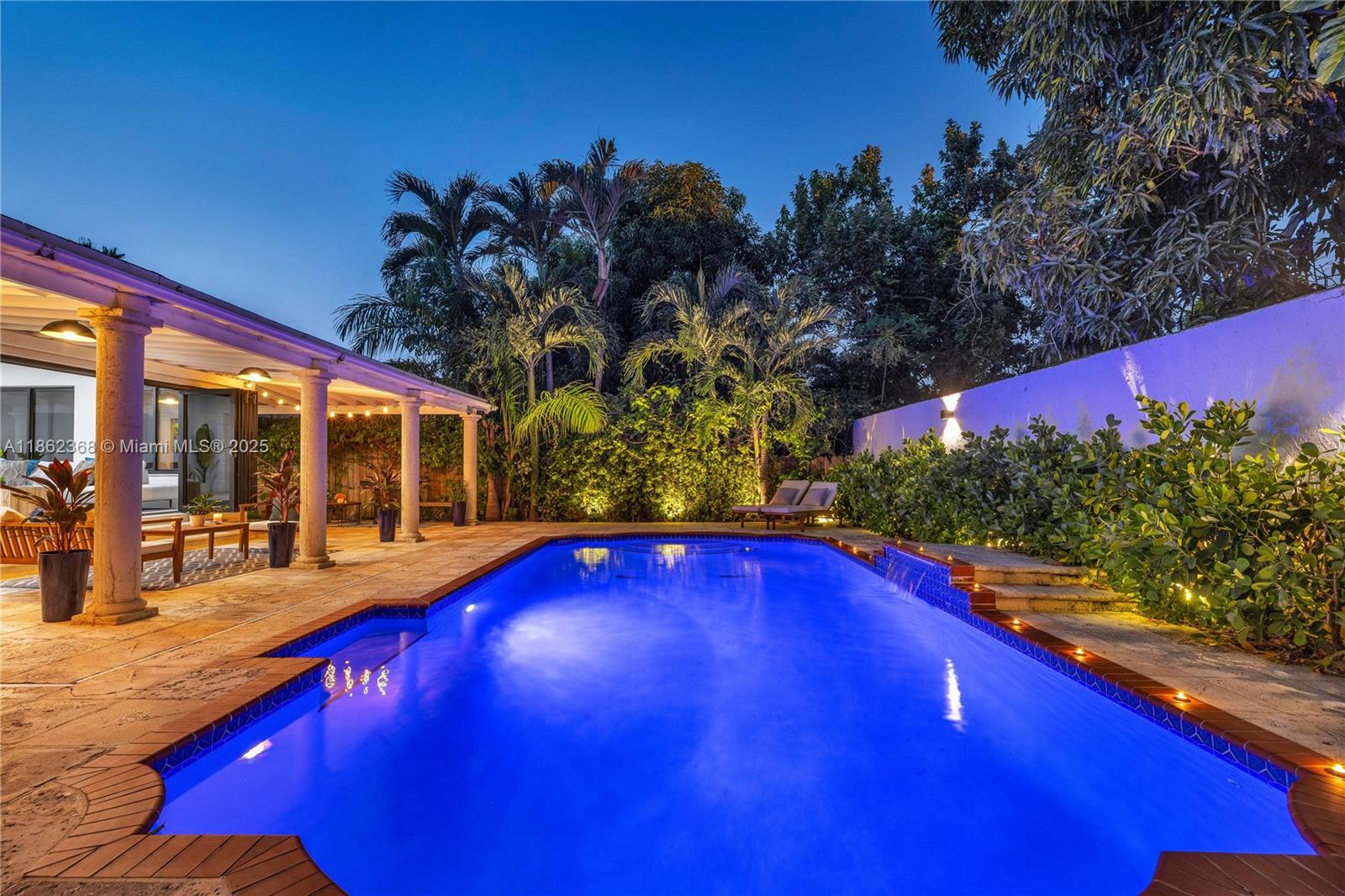 a view of swimming pool with outdoor seating and deck